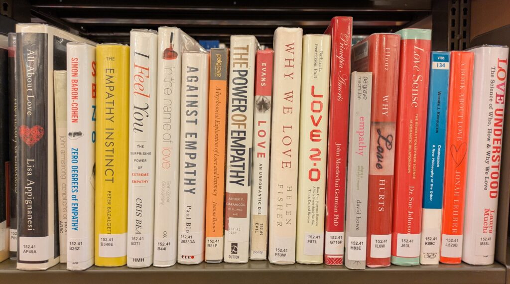 Photograph of a range of books on a library shelf, all about Love.