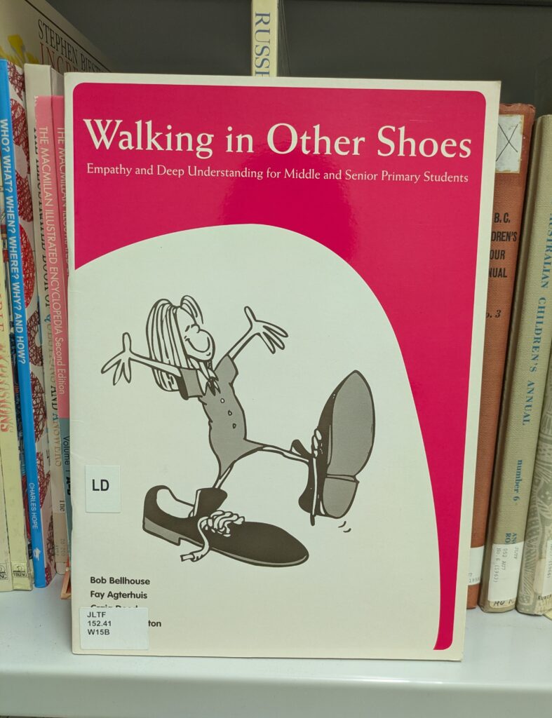 Photo of a book sitting on a shelf.