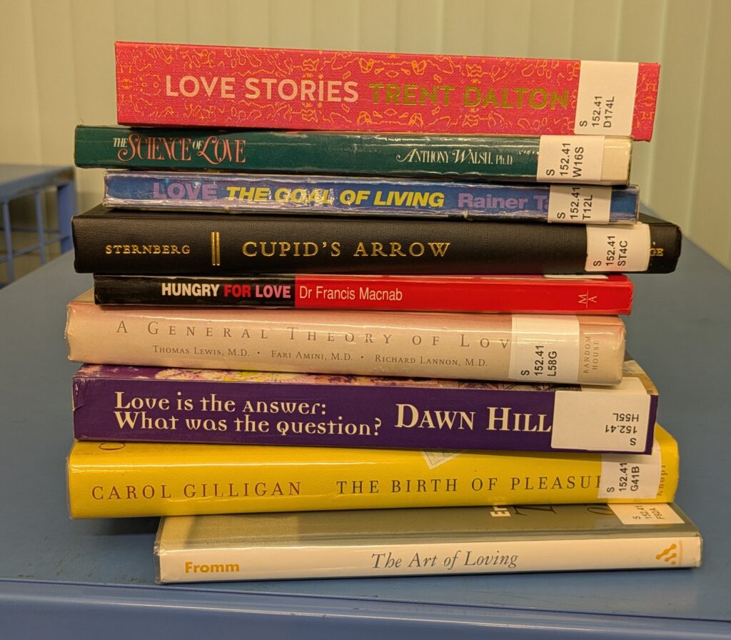 A stack of books on the theme of Love.